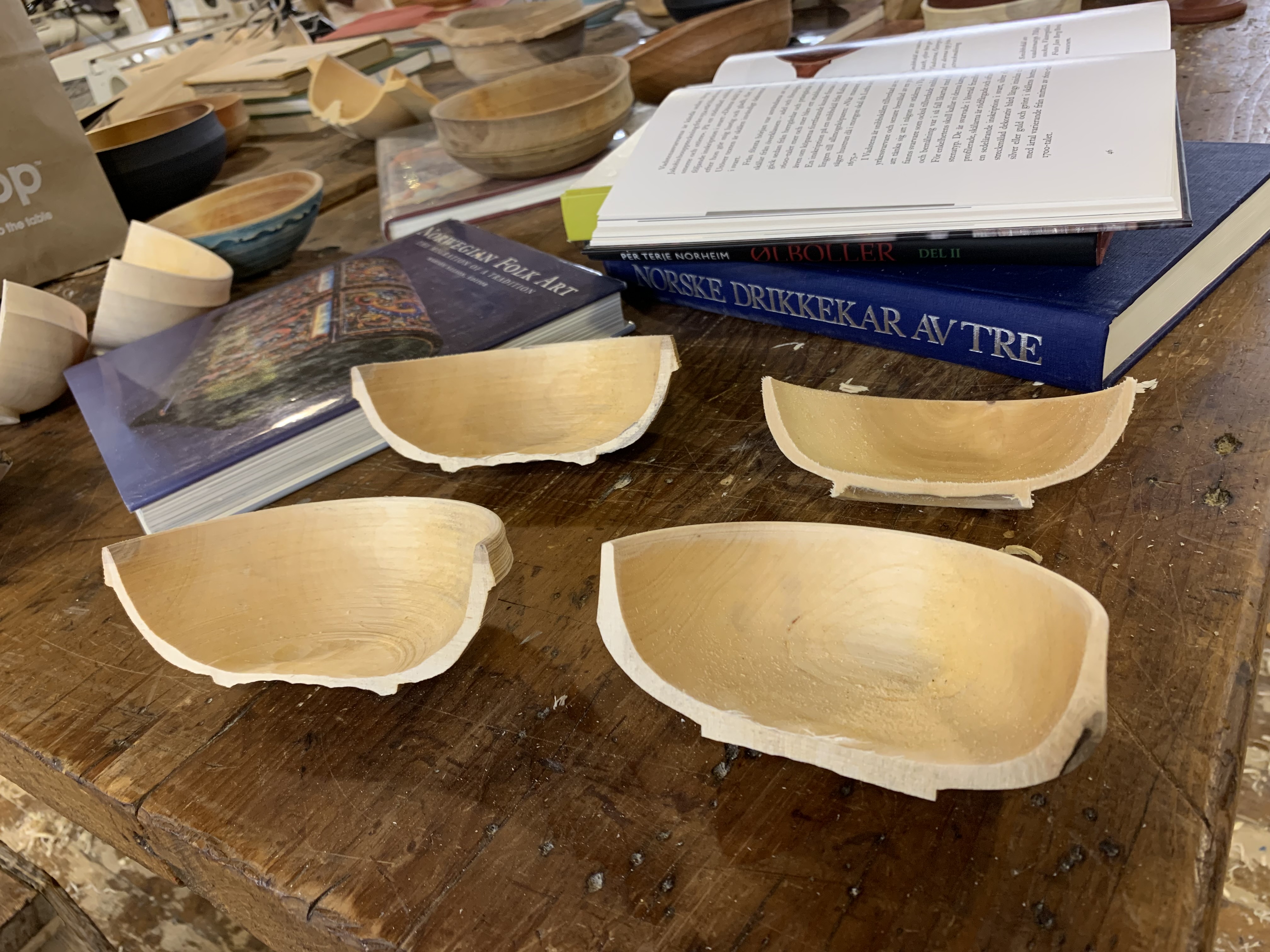 Four wooden bowls that Mary Tripoli cut in half